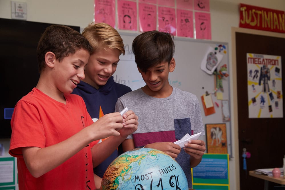 Middle School social studies students celebrate Y1K win